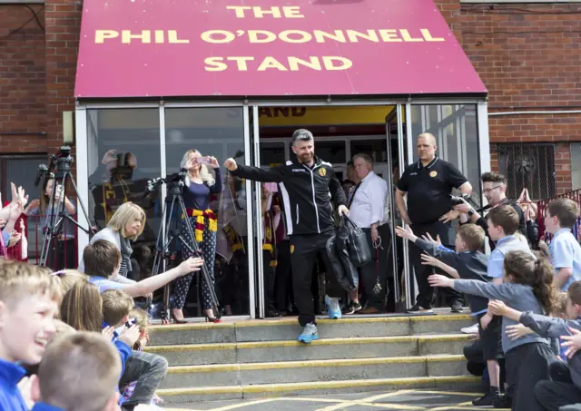 Stephen Robinson salutes the Motherwell supporters