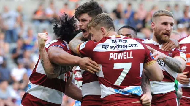 Wigan celebrate a try