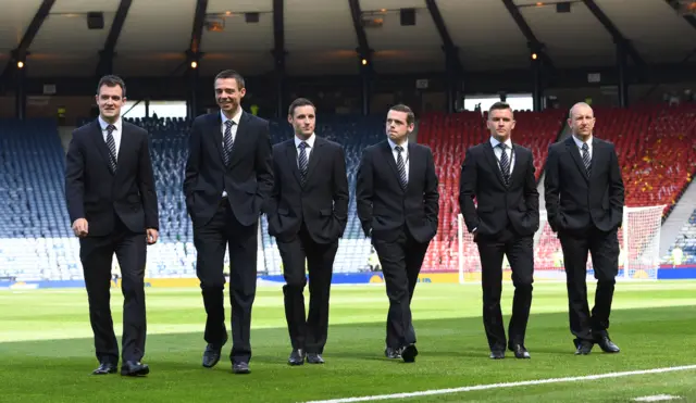 Referee Kevin Clancy and officials at Hampden