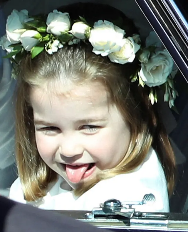 Princess Charlotte sticks out her tongue