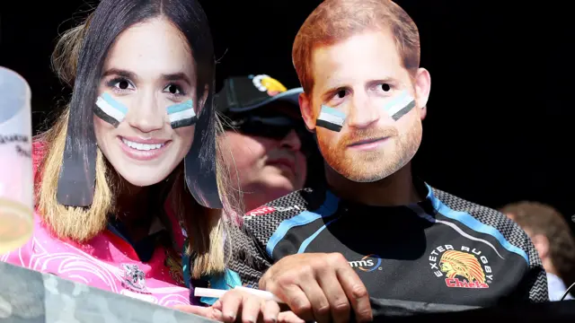 Exeter fans wear masks of Prince Harry and Meghan Markle