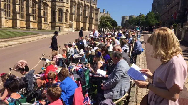 Crowd following wedding ceremony