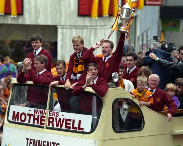 Motherwell players enjoy an open-top bus parade after winning the Scottish Cup in 1991