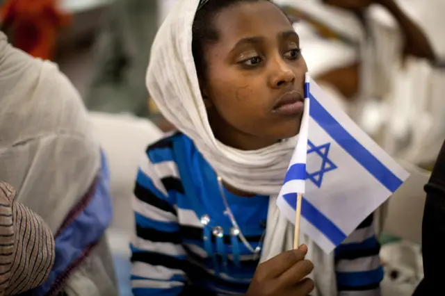 A new Jewish immigrant during a welcoming ceremony after arriving on a flight from Ethiopia, on October 29, 2012 at Ben Gurion airport near Tel Aviv, Israel.