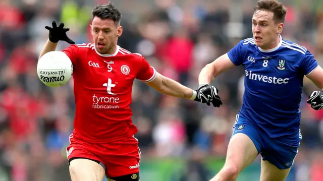 Tyrone's Mattie Donnelly guards possession from Monaghan's Niall Kearns during the first half