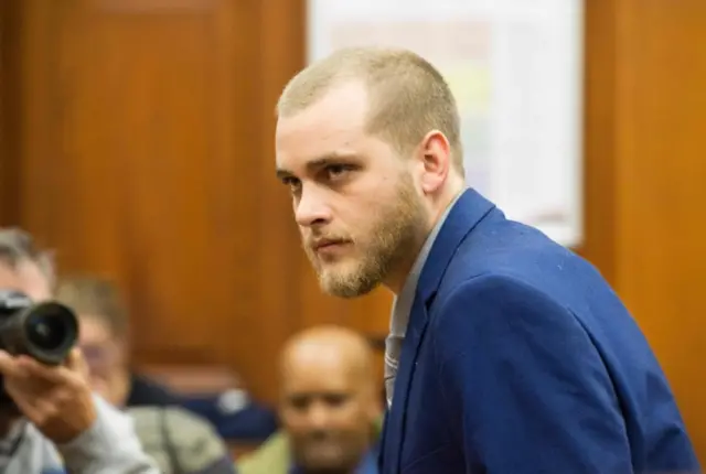 Henri van Breda arrives to sit in the dock at the Western Cape High Court to hear the verdict in his trial for allegedly killing his two parents, brother and maiming his sister with an axe in their luxury home, in Cape Town on 21 May 2018