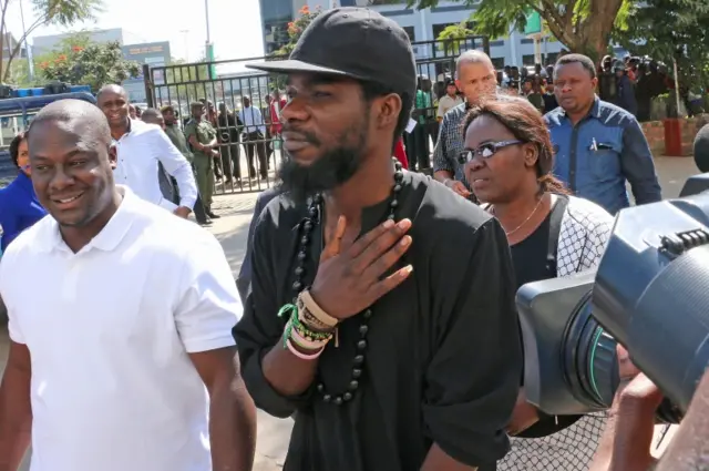 Zambian musician Fumba Chama, also known as Pilato, arrives at Lusaka Central Police station for questioning after police summoned him over a song he had released in Lusaka on June 8, 2015.