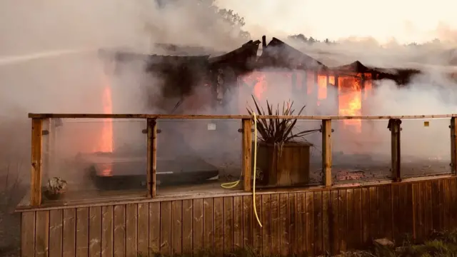 The wooden building ablaze