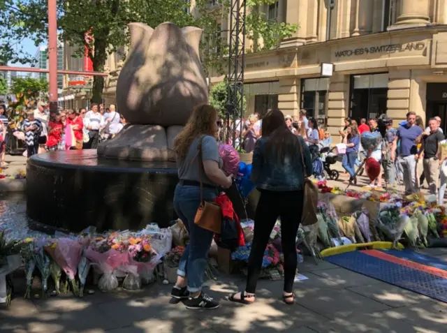 People gather in St Ann's Square