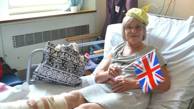 Jean Smith after the operation, with hat and flag