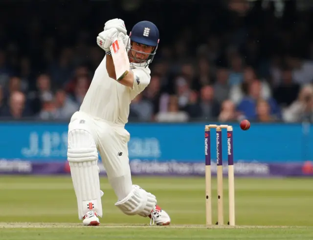 Alastair Cook drives for four