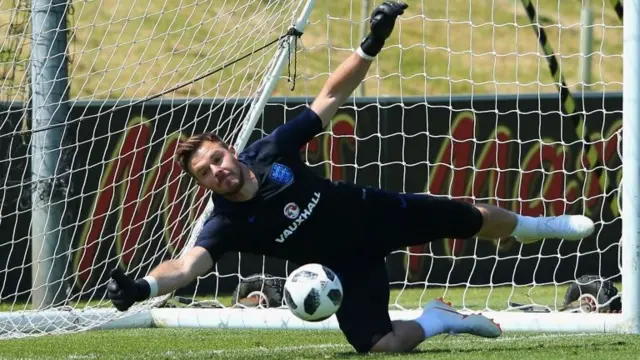 Jack Butland of England makes a save during a training session