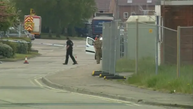 Police and army officers at their cordon