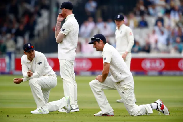 Dawid Malan and Alastair Cook of England on their knees