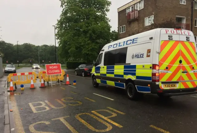 Police vehicles at stabbing scene