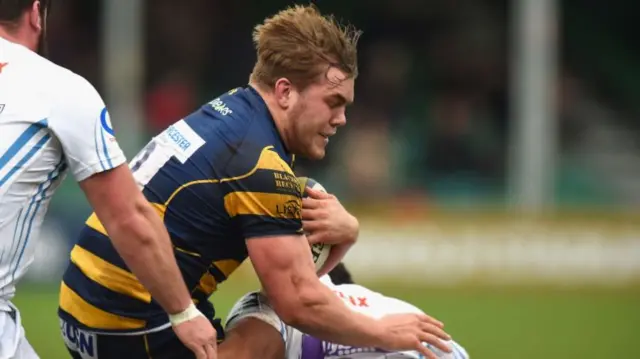 Jack Singleton of Worcester Warriors is tackled