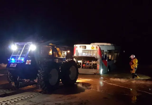 Bus being towed by RNLI