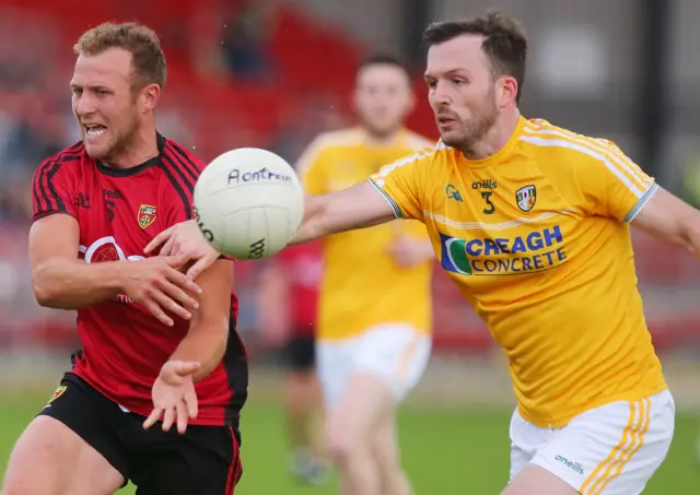 Down's Darren O'Hagan and Patrick Gallagher of Antrim in action at Pairc Esler