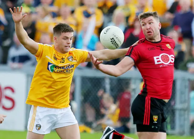 Antrim's Peter Turley and Patrick McBride of Down in action at Pairc Esler