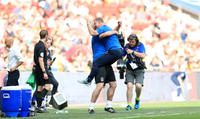 Mark Robins celebrates