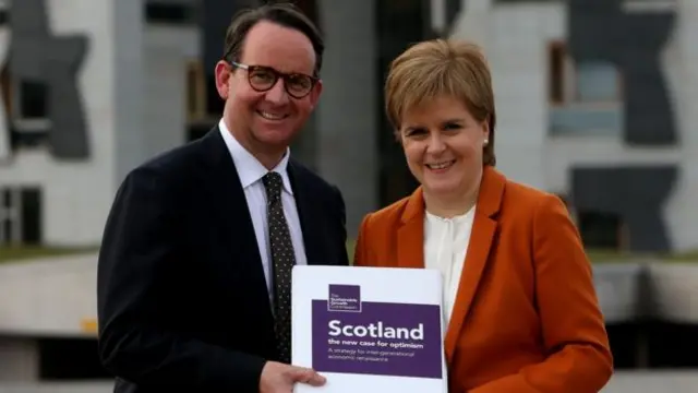 Andrew Wilson and Nicola Sturgeon holding the growth commission report