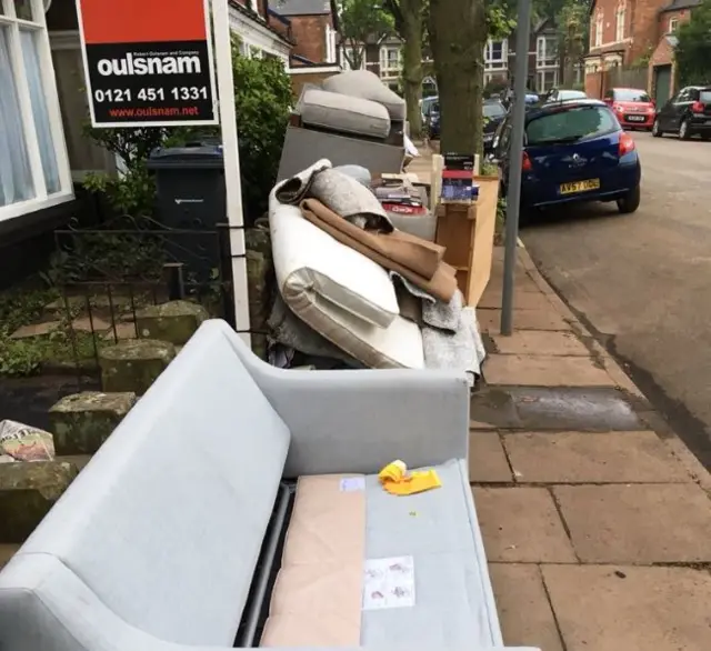 Furniture outside homes in Selly Oak, Birmingham after flooding in May 2018