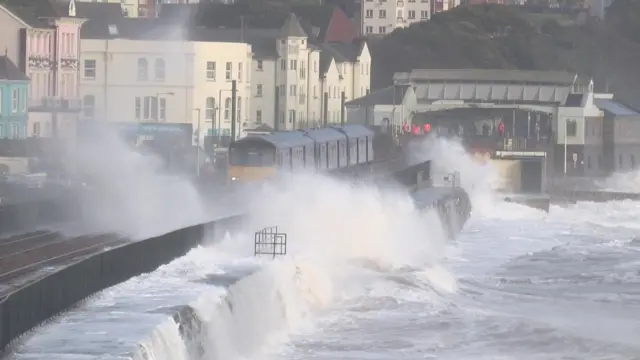 waves crashing into train at Dawlish