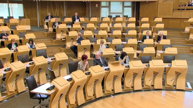 Bob Doris standing in the chamber