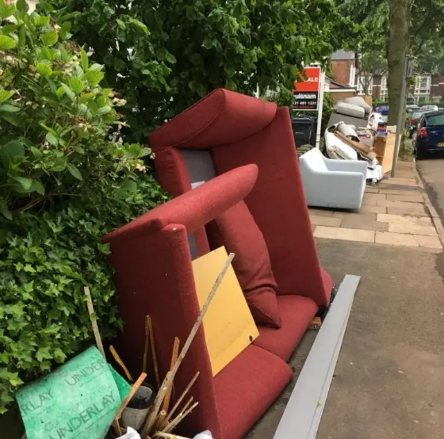 Furniture outside homes in Selly Oak, Birmingham after flooding in May 2018