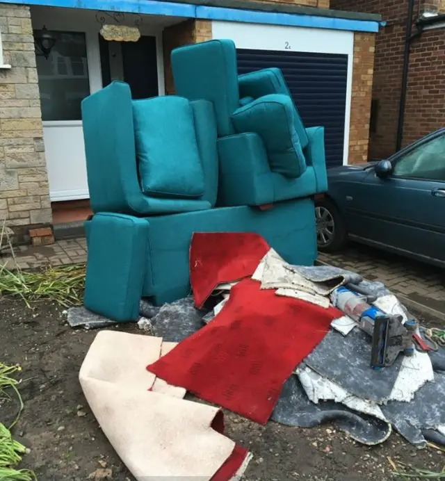 Furniture outside homes in Selly Oak, Birmingham after flooding in May 2018