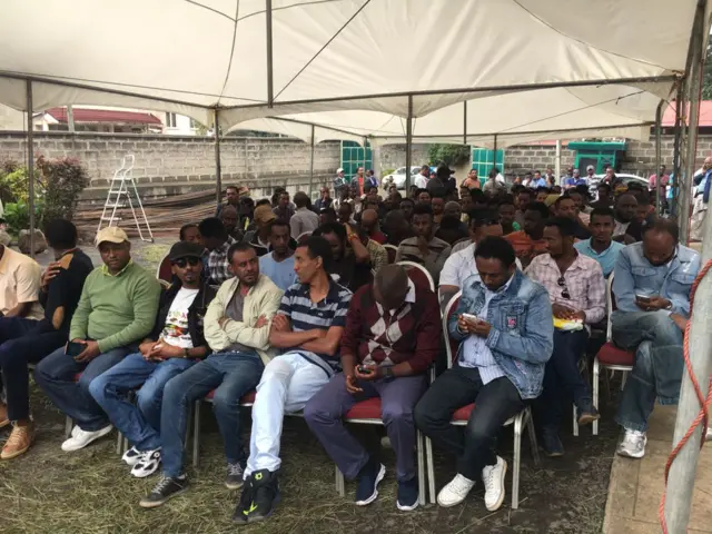 People wait for for the release of Ethiopia’s opposition figure Andargachew 'Andy' Tsege