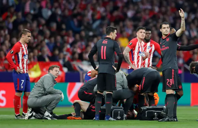 Arsenal's Lauren Koscielny goes down injured