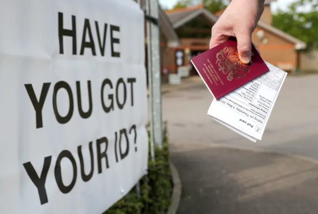 Voter with ID at polling station