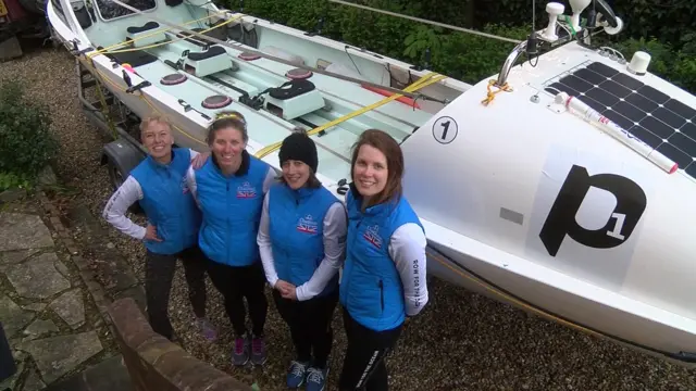 Four rowers and ocean-going rowing boat