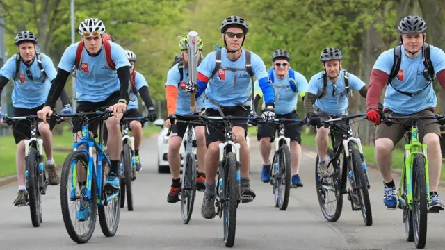 The baton being held on a bike