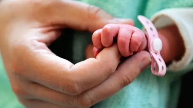 Baby hand in hospital