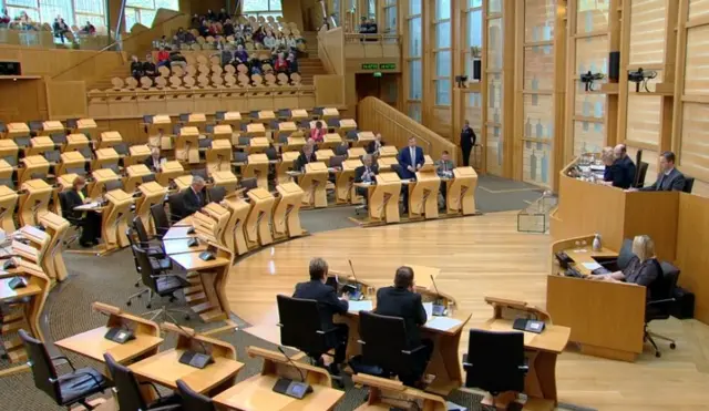 Finlay Carson standing in chamber