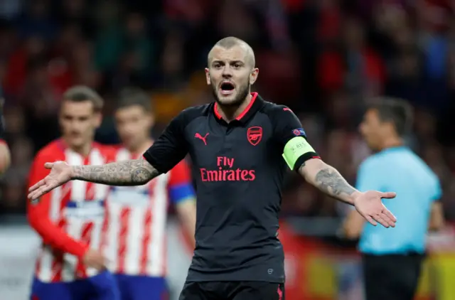 Arsenal's Jack Wilshere is shown a yellow card