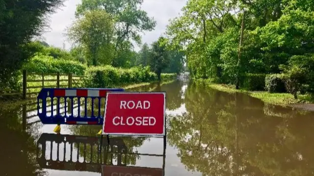 Road in Lapworth shut by flooding