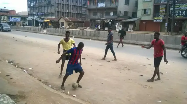 The children playing football  on fox  street Ariaria