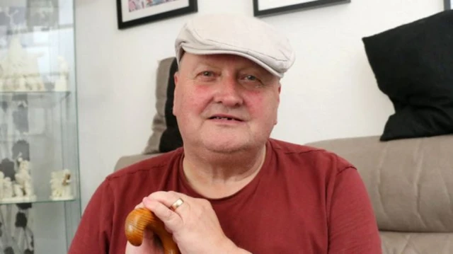 Graham Cattermole, wearing a flat cap