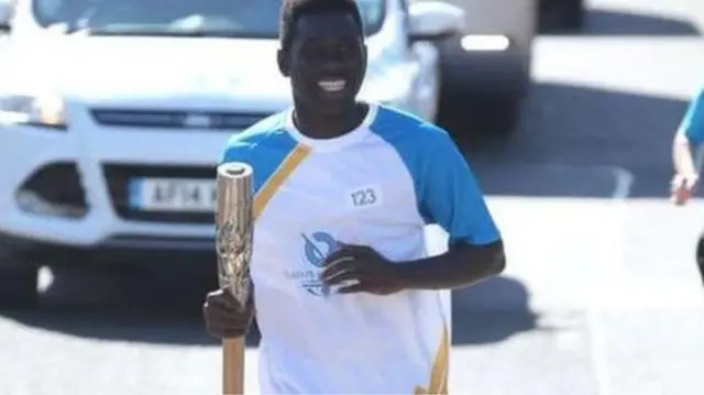 Denzel Darku carried the Queen's Commonwealth Games baton in the lead-up to Glasgow 2014