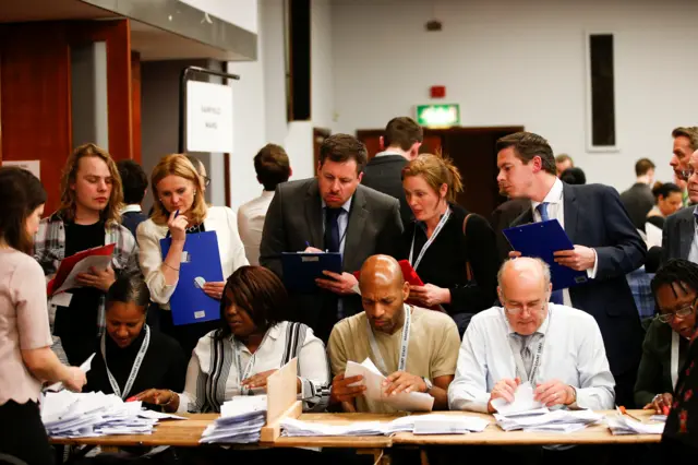 Volunteers count ballot papers at Wandsworth Town Hall