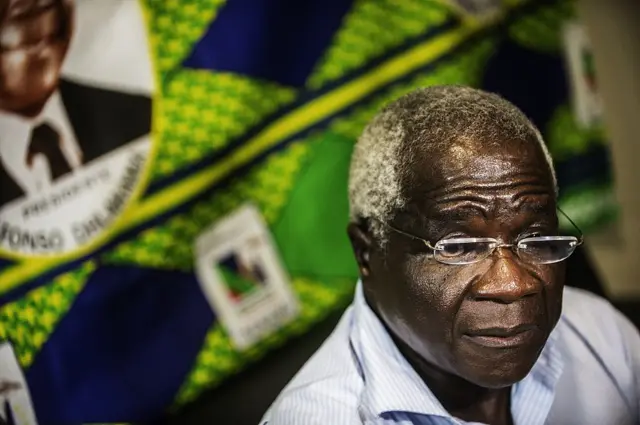 Mozambican Resistance Movement (RENAMO) presidential candidate Afonso Dhlakama (C) speaks during an interview on October 11, 2014 in Maputo, Mozambique.