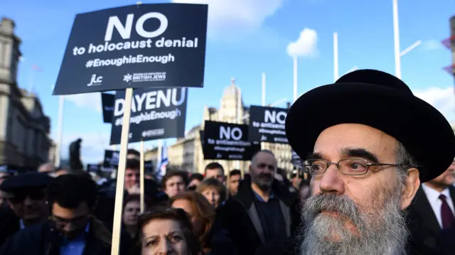 Members of London"s Jewish community protest outside The British Houses of Parliament