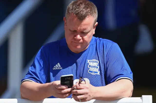 Birmingham City fan on a phone