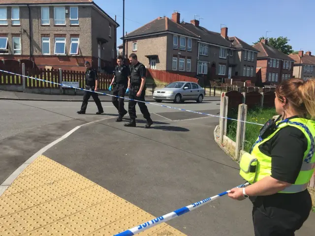 Police at an estate in Sheffield following shooting