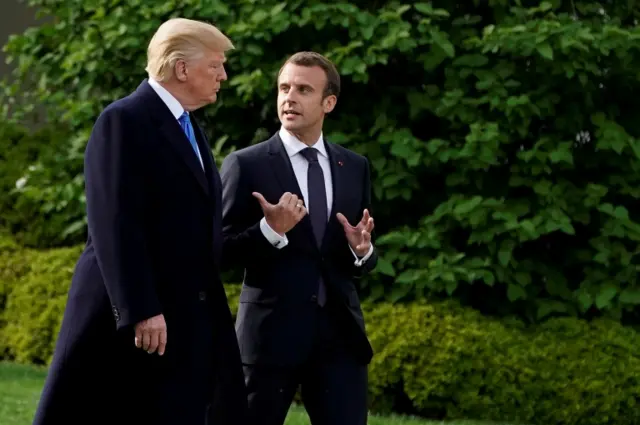 Trump and Macron walking outside the White House