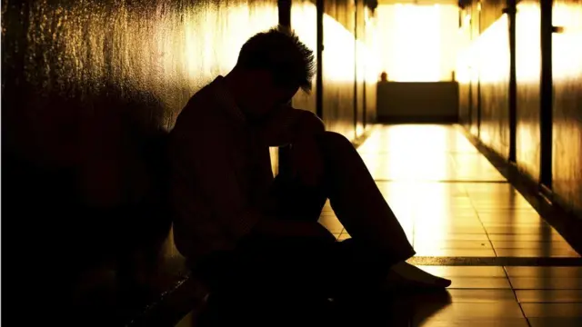 Man alone in hallway