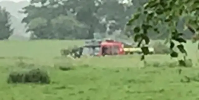 Helicopter in field